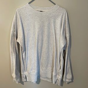Grey crew neck with pockets.